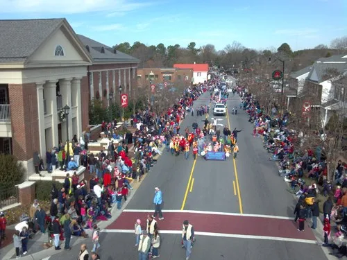 The Christmas parade travels through downtown Holly Springs, NC