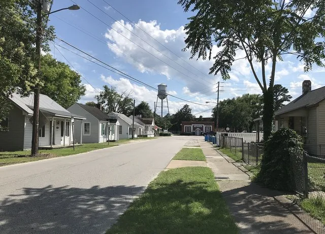 Residential street in Hope Mills with Gardner Building in background
