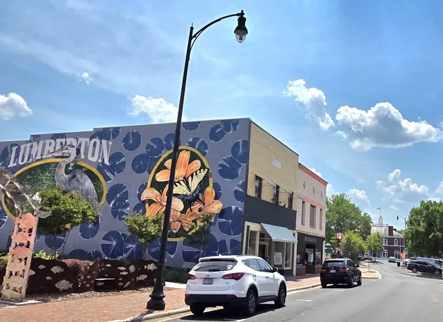 Downtown Lumberton, NC - North Elm St. mural and historic fire station in the background