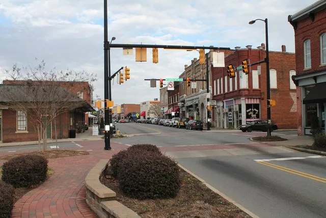 A view down Main Street in Mooresville, North Carolina's central Historic District (NRHP-listed); to the left is the town's historic rail depot.