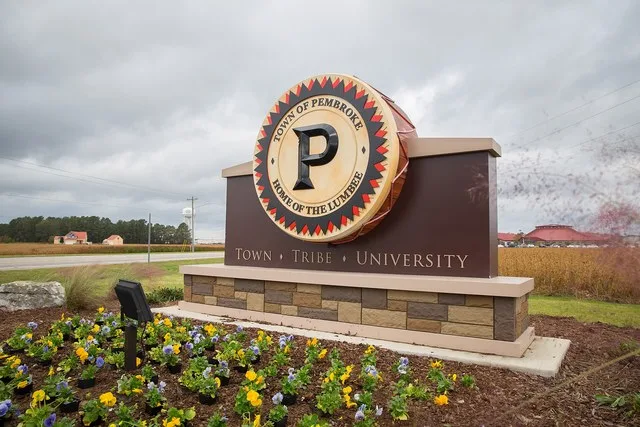 Town of Pembroke welcome sign. Town. Tribe. University.