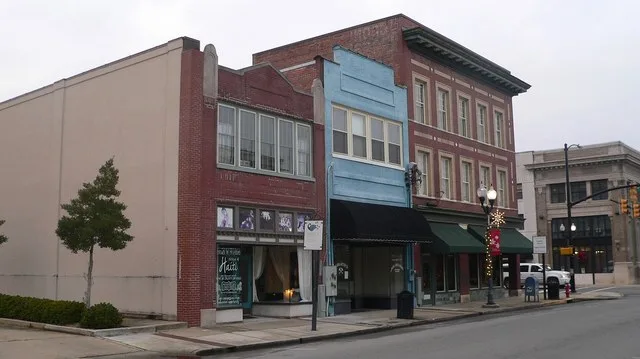 Southwest corner of Third and Market Streets in Smithfield, North Carolina; camera is looking generally northward, obliquely across Third. From left to right are 108 S. 3rd, 106 S...