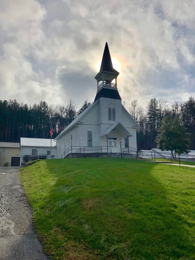 This is the Webster Baptist Church, located along North Carolina Highway 116 and the Tuckaseigee River in the town of Webster, North Carolina. Constructed in 1900, the Late Vernac...