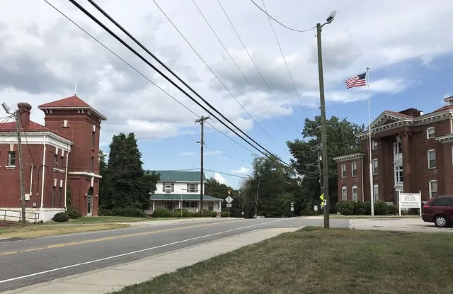 Center of Wentworth, North Carolina. The former Rockingham County Jail stands at the left, and the former Rockingham County Courthouse stands at the right