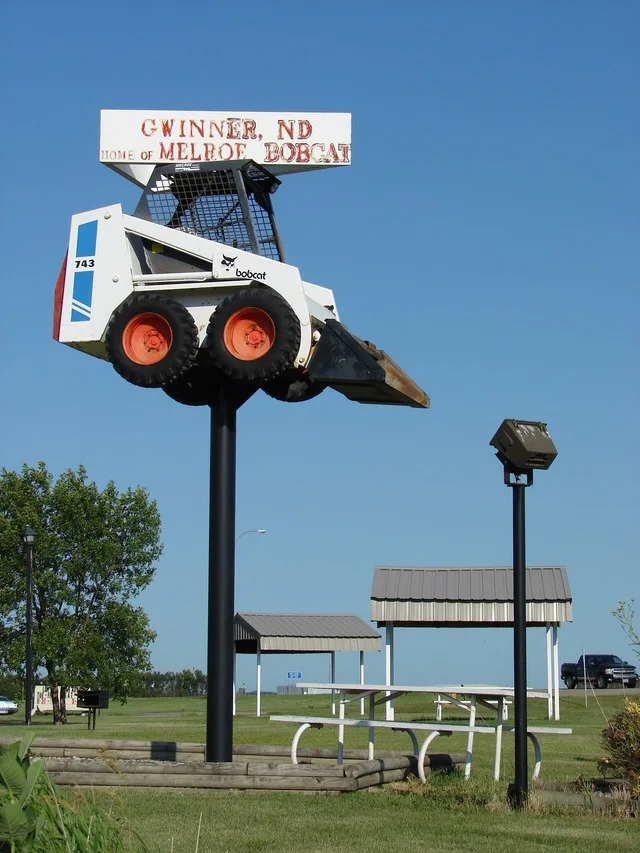 A Bobcat 743 skid-steer loader which is mounted on a pole welcomes visitors to Gwinner, North Dakota. It is located at the western intersection of ND Highway 13 and ND Highway 32...