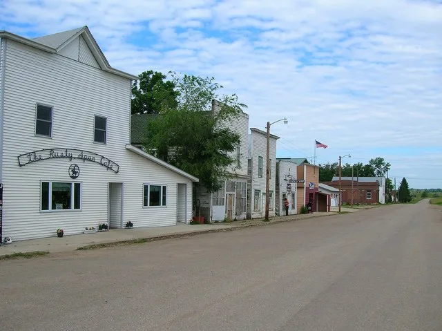 Scope and content: The original finding aid described this photograph as: Original Caption: The white storefronts in Kathryn have been preserved close to their historic 1900s stat...