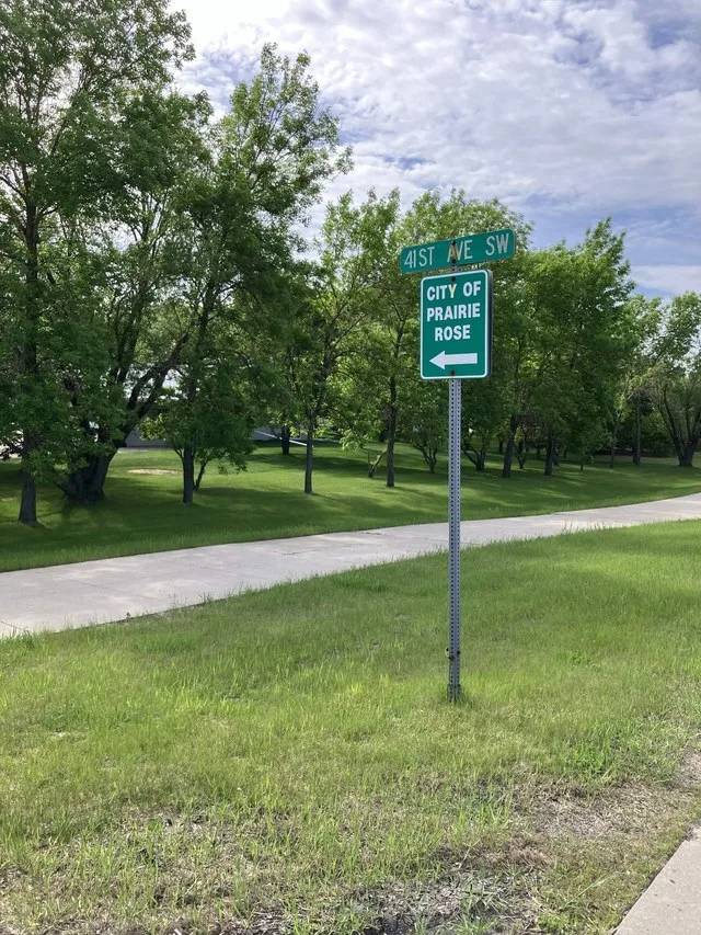 Street sign for Prairie Rose, North Dakota.