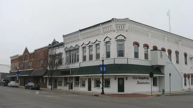 Buildings on the southwestern corner of the junction of Main ( State Route 235 ) and Buckeye Streets in Ada , Ohio , United States .