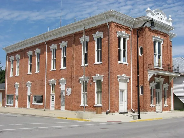Front and southern side of the Brown Township Building , located on the northwestern corner of Main ( State Route 118 ) and Weller Streets in central Ansonia , Ohio , United State...