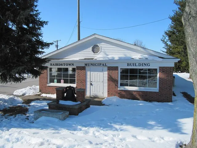 Photograph of the municipal building en of the village of Bairdstown , Ohio en , taken at street level from near the intersection of West Main and North Randolph streets.