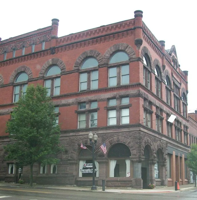 The Bradfield Building in Barnesville, Ohio. The building stands on the north eastern corner of Main and Chestnut Streets. The building is photographed from across Chestnut Street...