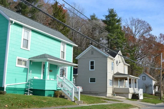 Houses on Main Street ( State Route 821 ) east of Walnut Street in Belle Valley , Ohio , United States .