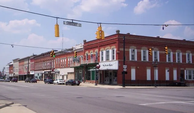 Downtown Bellevue, Ohio on East Main Street at the intersection of Sandusky Street looking west.