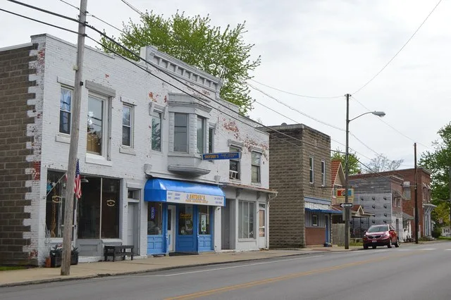 Buildings on the southeastern side of the 200 block of State Street ( State Route 12 ) in the commercial district of Bettsville , Ohio , United States .