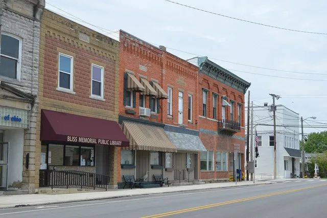 Buildings on the western side of the first block of S. Marion Street ( State Route 19 ) in central Bloomville , Ohio , United States .