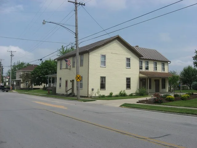 Front and northern side of the Shelby House , located at 403 W. State Street in Botkins , Ohio , United States . A former coach house built in 1864, it is listed on the National R...