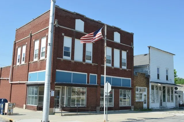 Buildings on the southern side of Crocker Street, seen looking west from Main Street, in Bradner , Ohio , United States .