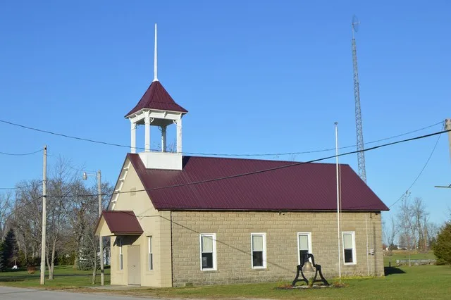 Southern side and front of the town hall in Broughton , Ohio , United States . It was built in 1904.