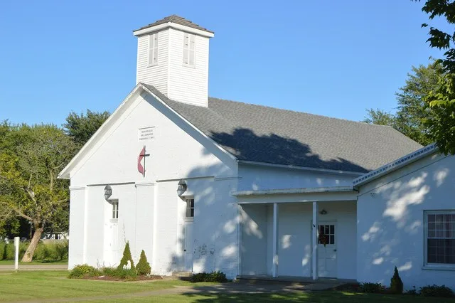 Front and southern side of the Butlerville United Methodist Church, located at 8494 Main Street ( State Route 132 ) in Butlerville , Ohio , United States . It was built in 1857.