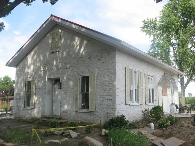 View from the southwest of the Casstown Lutheran Stone Church , located at 11 S. Main Street in Casstown , Ohio , United States . Built in 1839 and since converted into a house, i...