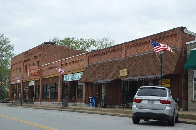 Buildings on the northern side of Main Street ( State Route 101 ) immediately east of its junction with Washington Street in central Castalia , Ohio , United States .