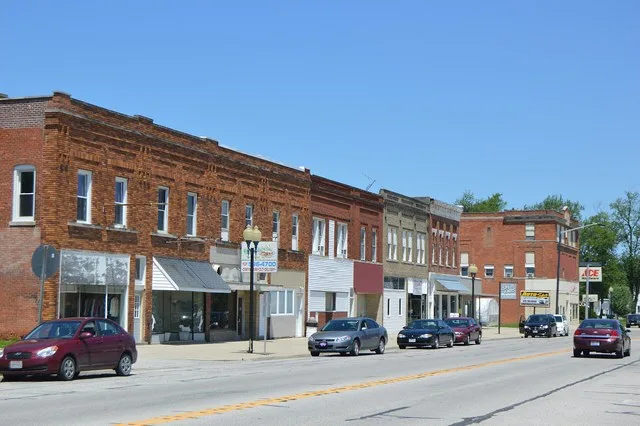 Commercial buildings on the western side of Main Street ( State Route 634 ) in Continental , Ohio , United States ; the Rice Street intersection is visible in the distance.