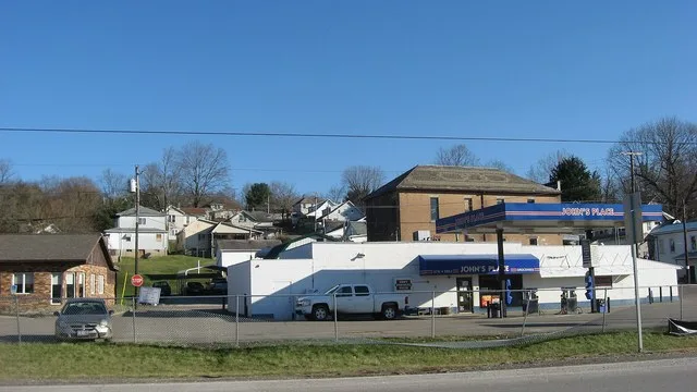 Looking eastward from State Route 13 toward houses and businesses in Corning , Ohio , United States .