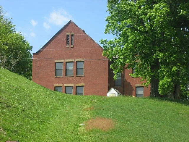 Southern side of the former West School , located on Cemetery Road in Crooksville , Ohio , United States . Built in 1904, it is listed on the National Register of Historic Places .