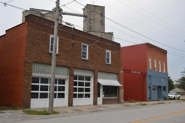 Buildings on Defiance Pike ( State Route 281 ) just east of the Superior Street intersection in Custar , Ohio , United States . The community grain elevator is visible in the back...