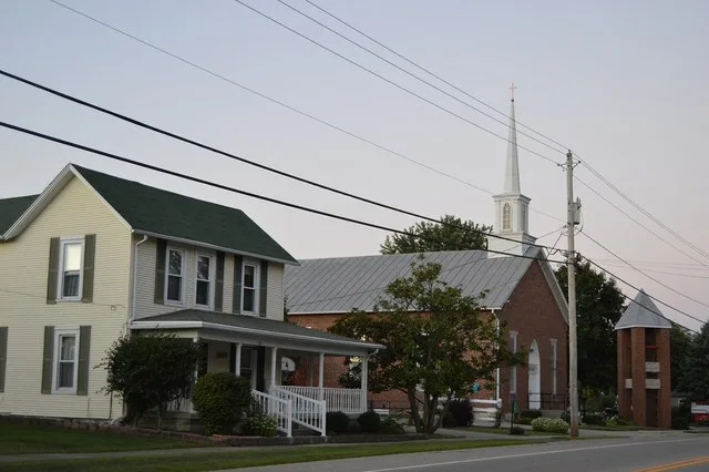 A house and the Donnelsville Lutheran Church, located on Main Street ( U.S. Route 40 ) just west of the School Street intersection in Donnelsville , Ohio , United States .