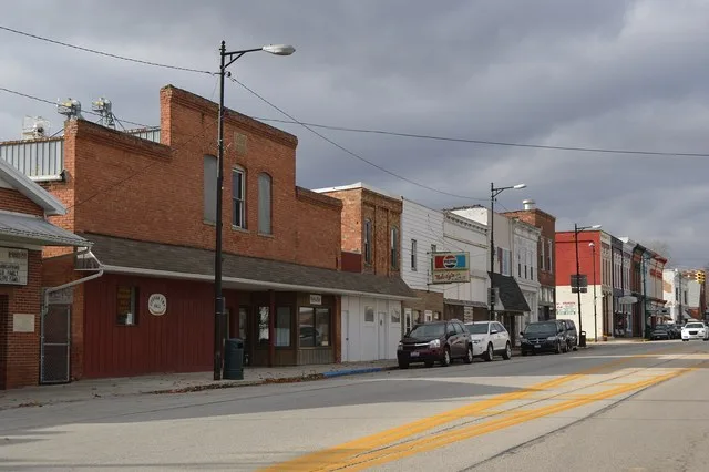 Buildings on the southern side of Main Street ( U.S. Route 20 ) just east of the Fayette Street intersection in Fayette , Ohio , United States .