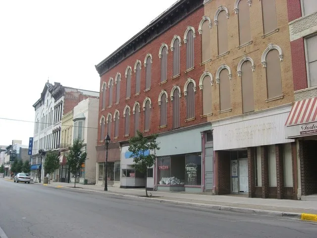 Buildings on the eastern side of the 100 block of N. Main Street ( State Route 18 ) on the Seneca County side of Fostoria , Ohio , United States . These buildings are part of the...