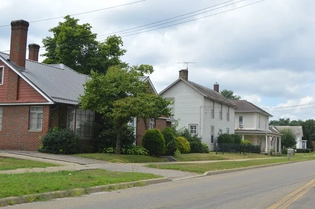 Houses on the southern side of Third Street west of State Street in Frazeysburg , Ohio , United States .
