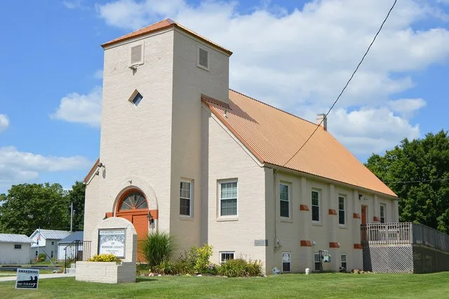 Front and eastern side of the Vineyard Church of Morrow County (formerly the Fulton Methodist Church), located at 104 W. Main Street in Fulton , Ohio , United States . It was buil...