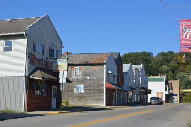 Buildings on the western side of High Street ( State Route 13 ), south of the Republic Avenue intersection, in Glouster , Ohio , United States .