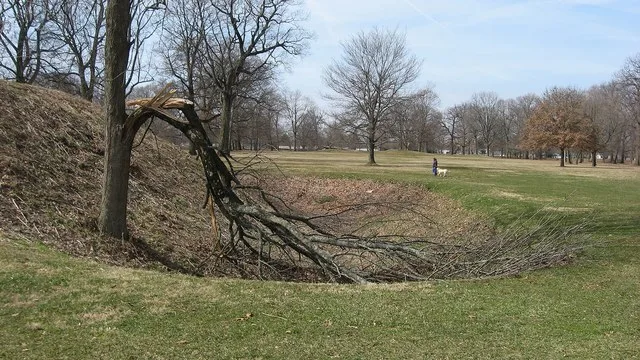 Opening of a ditch on the southern side of the gate to the Great Circle Earthworks in Newark , Ohio , United States ; note the nearby person for scale. Along with the Octagon and...