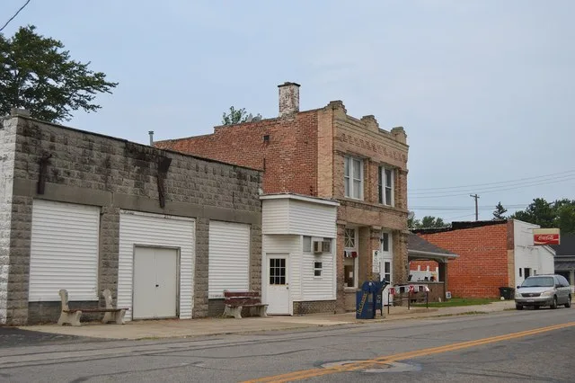 Buildings on the western side of Main Street (State Routes 18 and 235 ), seen looking north from Church Street, in Hoytville , Ohio , United States .