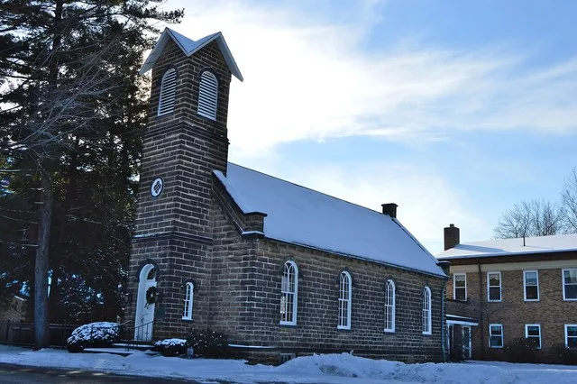 Northern side and front of the Independence Presbyterian Church , located along State Route 21 in central Independence , Ohio , United States . Built in 1853, it is listed on the...