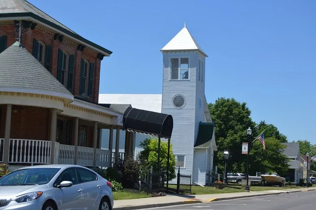 Houses and a former church located on the southern side of Pike Street ( State Route 274 ) west of Main Street in Jackson Center , Ohio , United States .