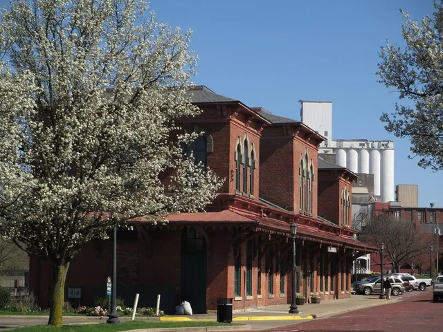 Old Atlantic & Great Western Rail Depot, built in 1875, in downtown Kent, Ohio with the Star of the West silo in the background.