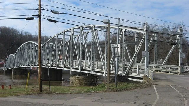 Eastern portal and southern (downstream) side of the Morgan County Veterans' Memorial Bridge, which spans the Muskingum River between Malta and McConnelsville , Ohio , United Stat...