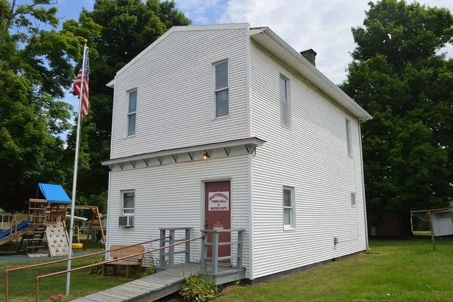 Front and southern side of the village hall in Martinsburg , Ohio , United States , located on Market Street ( U.S. Route 62 ) just south of Pleasant Street.