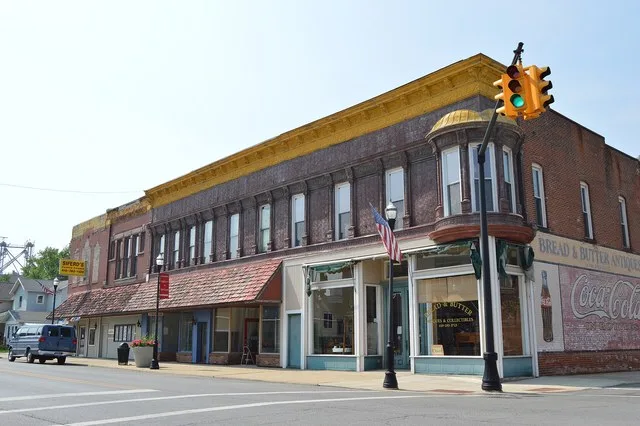 Buildings on Main Street ( State Route 613 ) in McComb , Ohio , United States . Photo looks northwest from the Todd Street intersection.