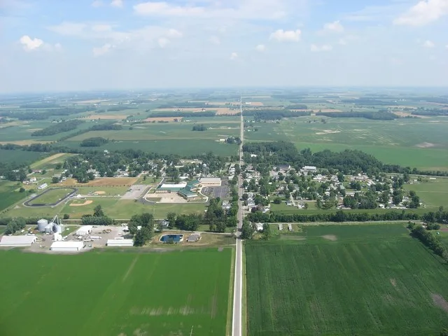 View of the Upper Scioto Valley High School in the village of McGuffey in western Hardin County , Ohio , United States . The vertical line is State Route 195 . Picture taken from...
