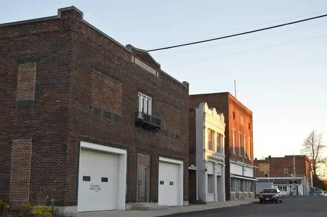 Buildings on the eastern side of the 100 block of N. Adams Street in Middle Point , Ohio , United States .
