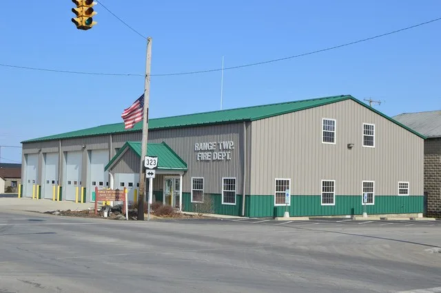 Front and southern side of the Range Township fire department, located on the northeastern corner of the junction of Main ( State Route 38 ) and Federal ( State Route 323 ) Street...