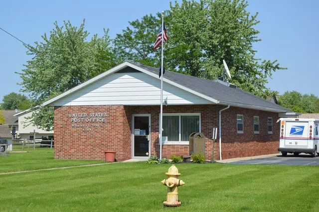 Front and southern side of the Millbury post office, located at 28506 Main Street in Millbury , Ohio , United States .