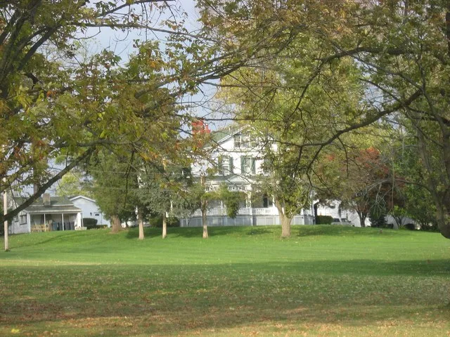 Front of Hughes Manor , located at 5894 Hamilton-Lebanon Road in Monroe , Ohio , United States . Built in 1889, it is listed on the National Register of Historic Places .