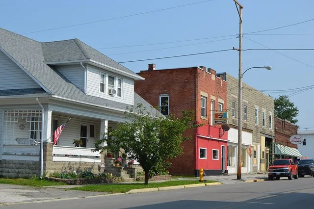 Commercial buildings and a house on the eastern side of the 100 block of N. Main Street ( State Route 37 ) in Mount Blanchard , Ohio , United States .