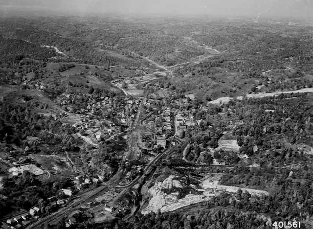 Scope and content: Original caption: Aerial view of Murry City, Ohio, coal mining town. Note the "gob pile" from coal mining & mine tipple in the center foreground. Athens R.D.
